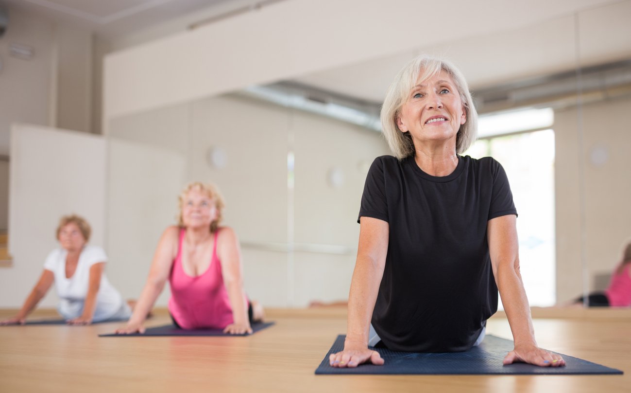 Seniors doing pilates for cardio exercises with vein issues