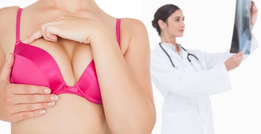 Composite image of closeup of woman performing self breast examination.jpeg