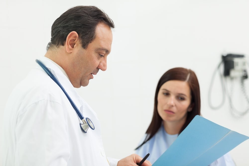 Doctor and a patient talking in an examination room