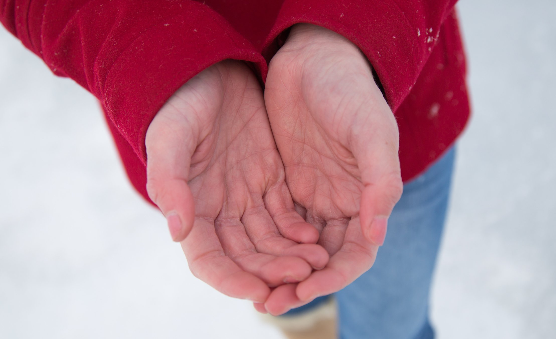 Man cupping hands in the cold weather